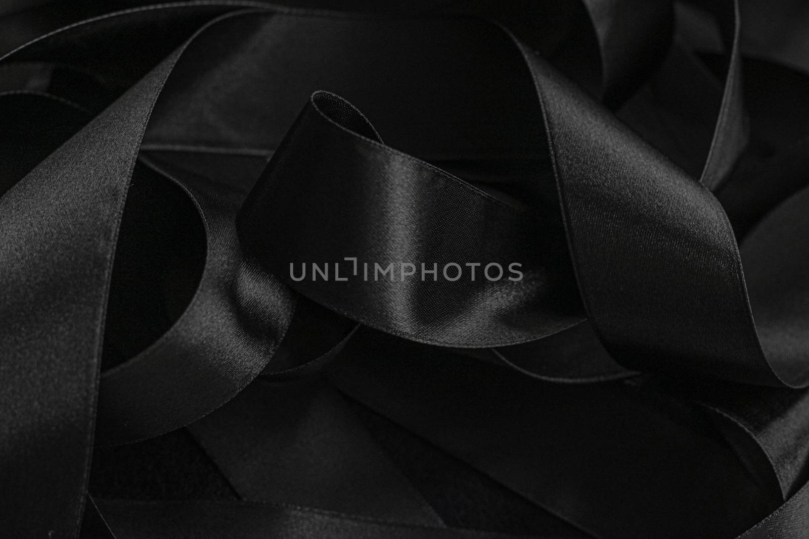 Black silk ribbon as background, abstract and luxury brand design by Anneleven