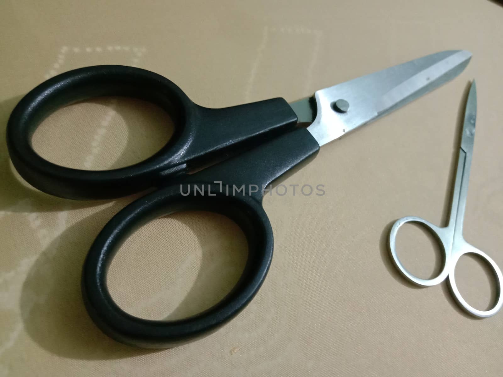 silver and black colored scissors closeup