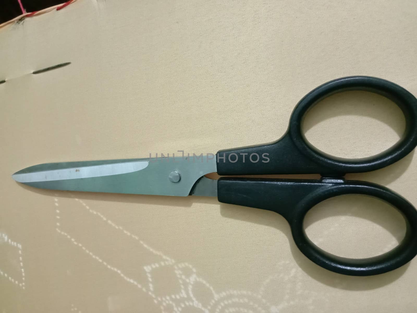 silver and black colored scissors closeup