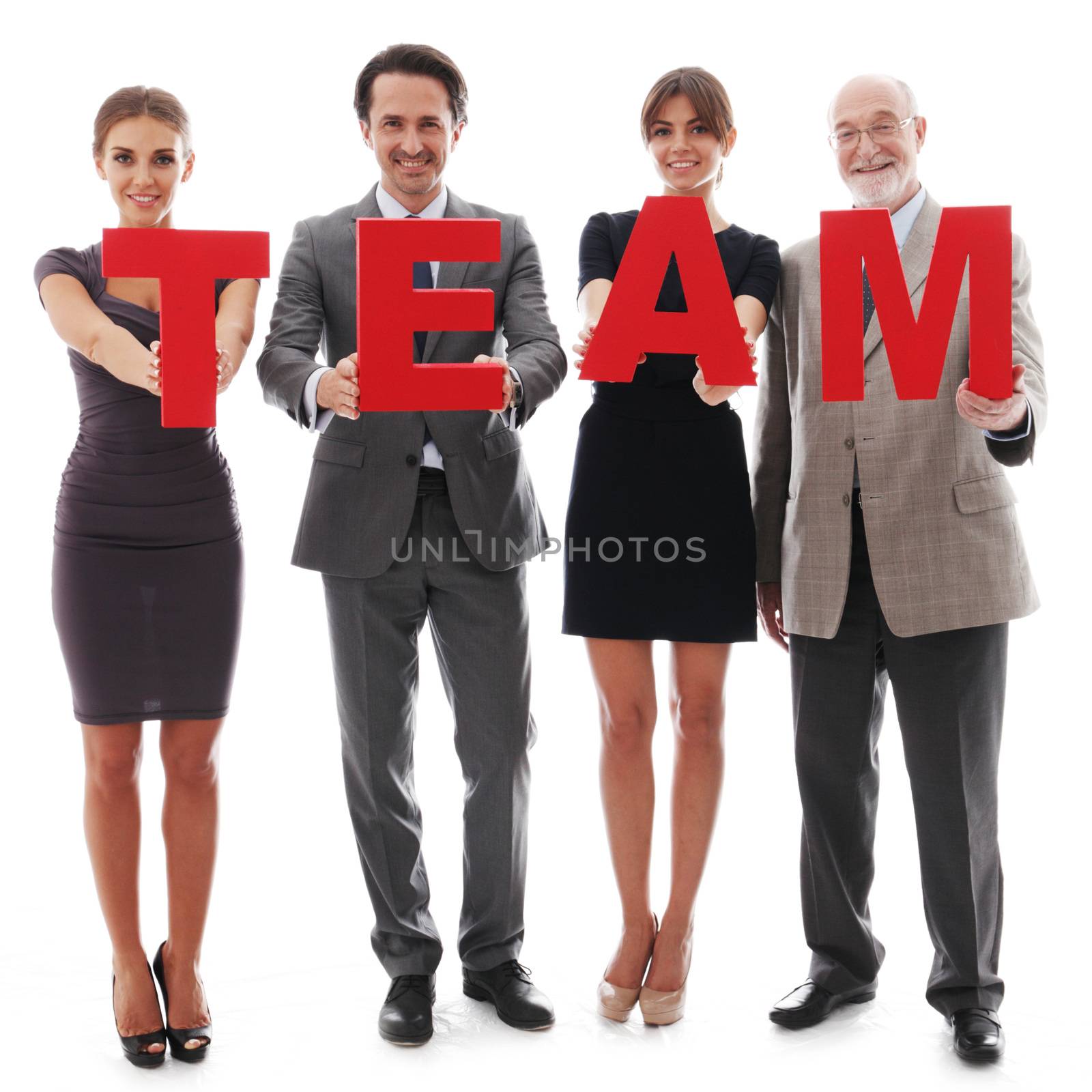 Business team holding the letters by ALotOfPeople