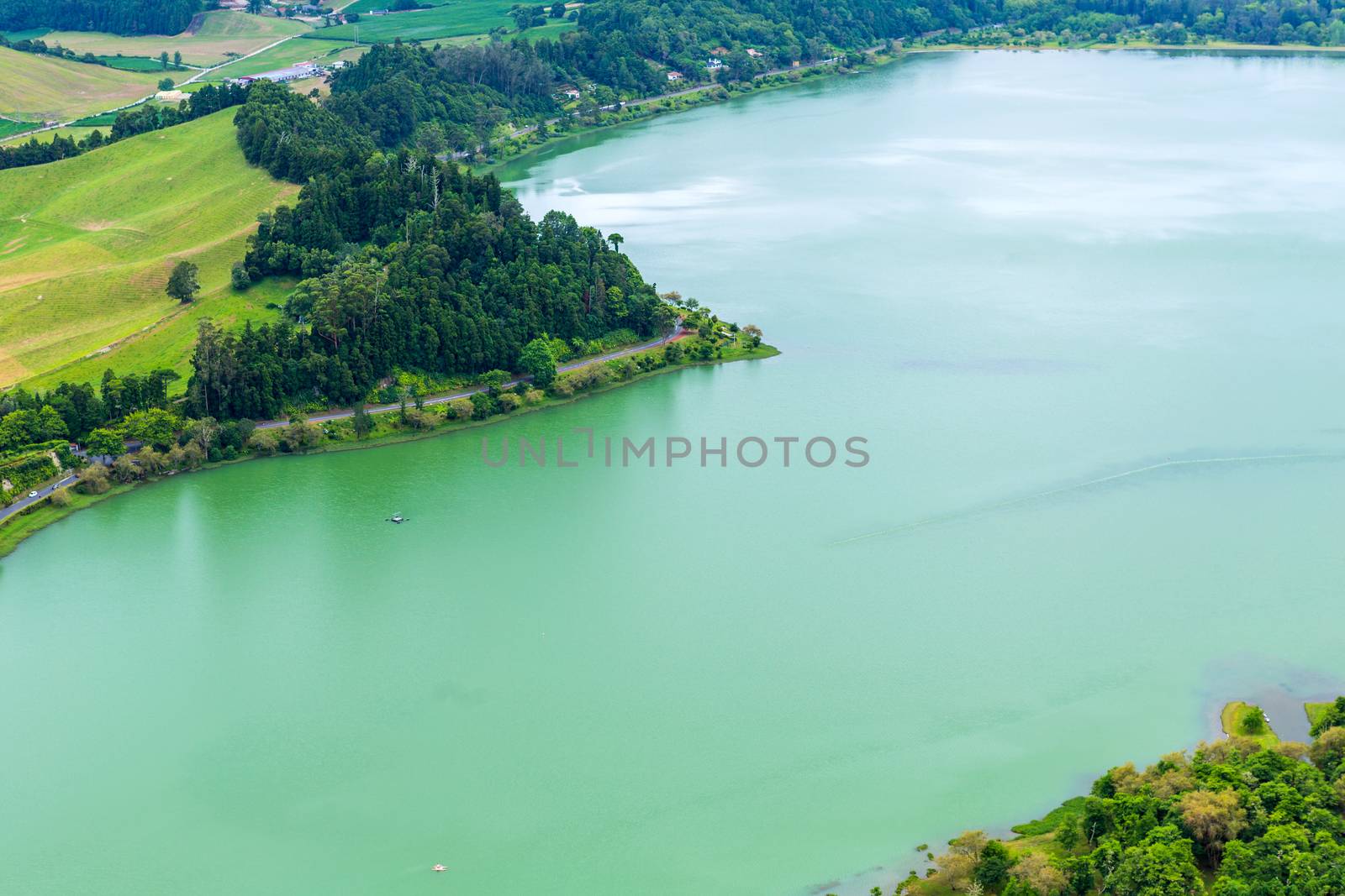 View of the Lake Furnas (Lagoa das Furnas) on Sao Miguel Island, Azores, Portugal from the Pico do Ferro scenic viewpoint. Tranquil scene of the lake in a volcanic crater