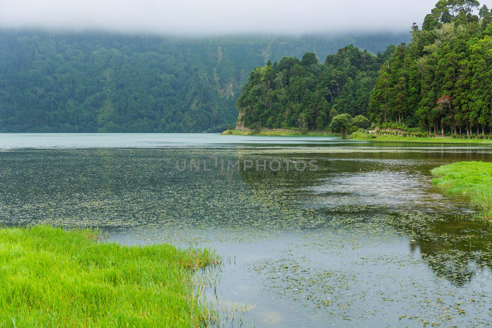 View of the Lake of Sete Cidades in the fog, a volcanic crater lake on Sao Miguel island, Azores, Portugal