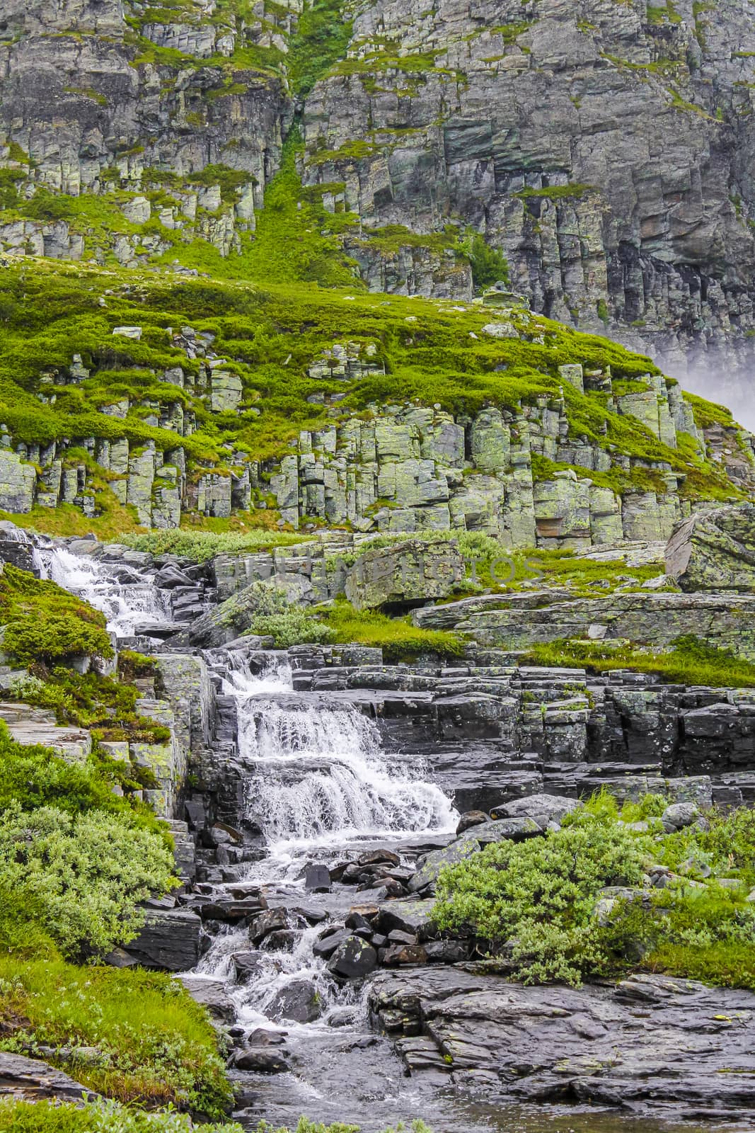 Hydnefossen waterfall and Hydna river on Veslehødn Veslehorn mountain in Hemsedal, Norway.