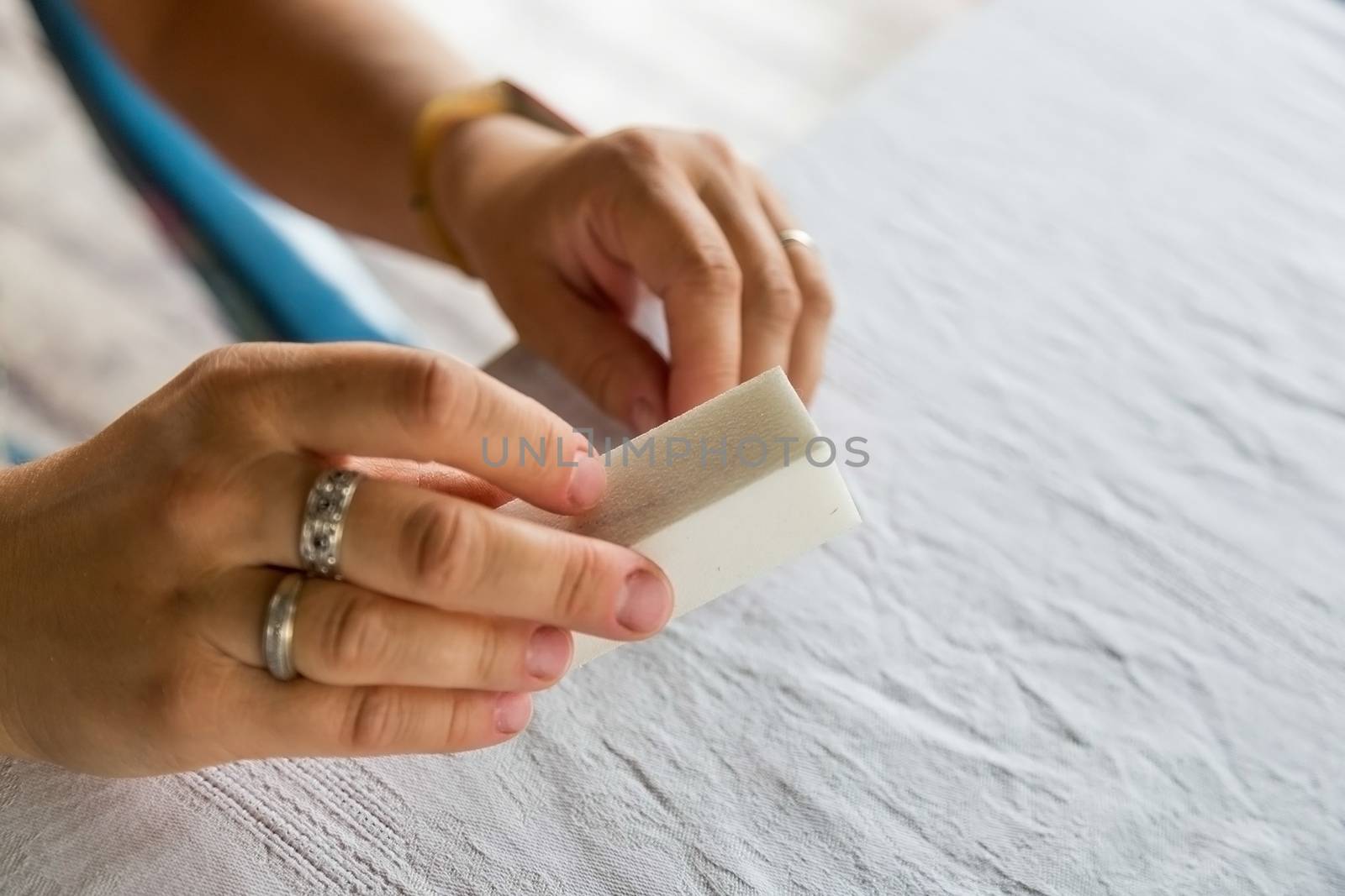 Removing varnish or degreasing nails. Preparation of nails for staining with varnish. Self manicure during self-isolation with coronovirus.