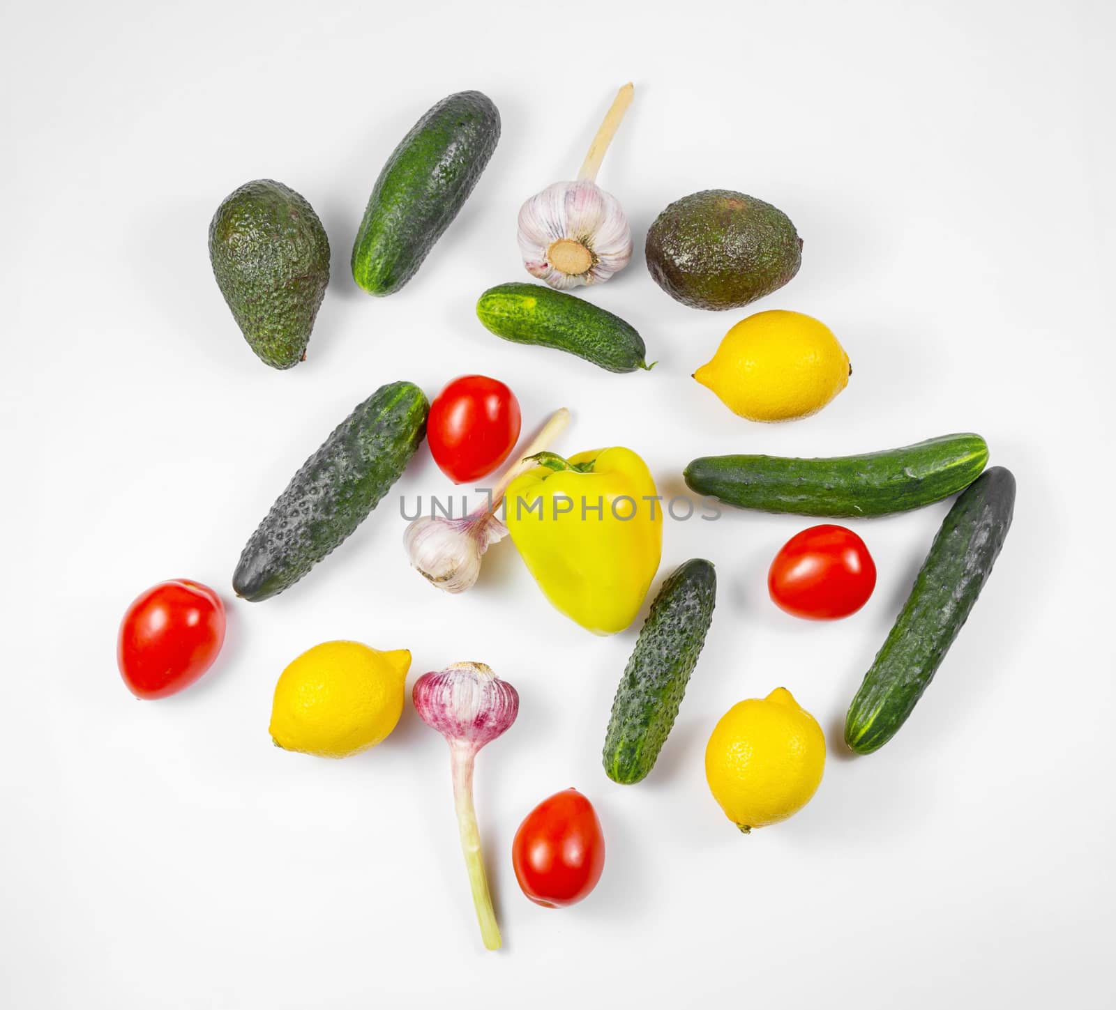 Shopping bag with assortment of fresh vegetables on white background