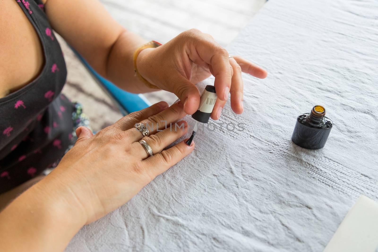 Staining nail gel polish. Self-manicure during self-isolation with coronovirus. The concept of personal care in all life circumstances