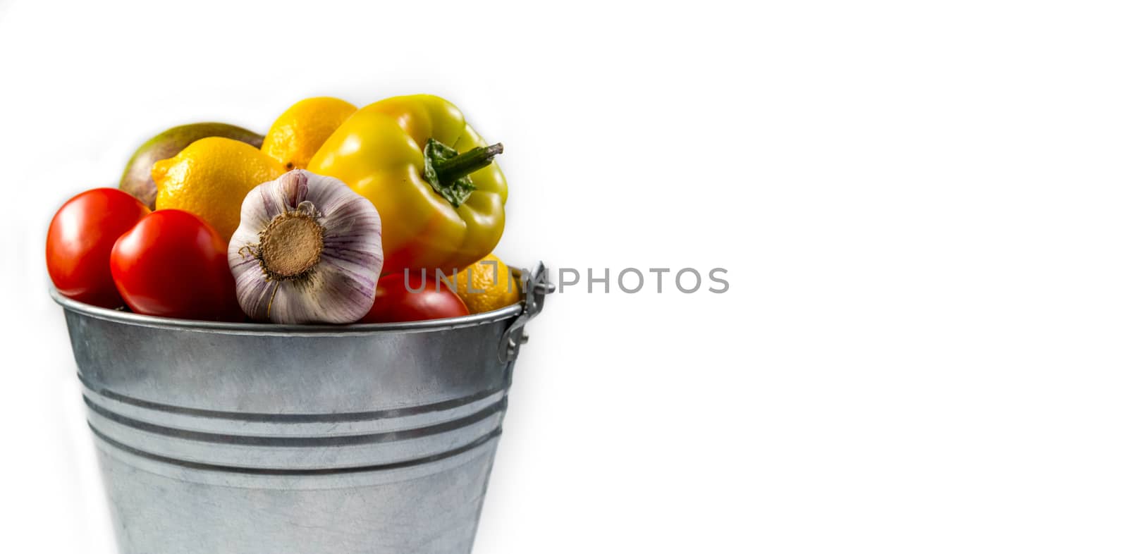 .Aluminum bucket with assortment of fresh vegetables on white background by galinasharapova