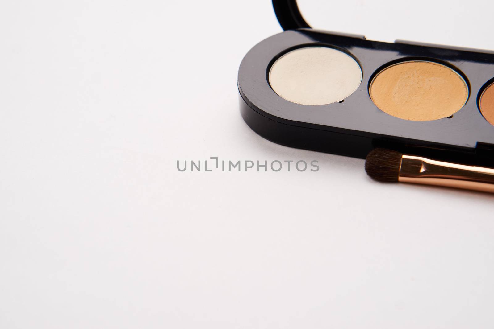 professional eyeshadow on isolated background and makeup brushes cosmetics fashion by SHOTPRIME