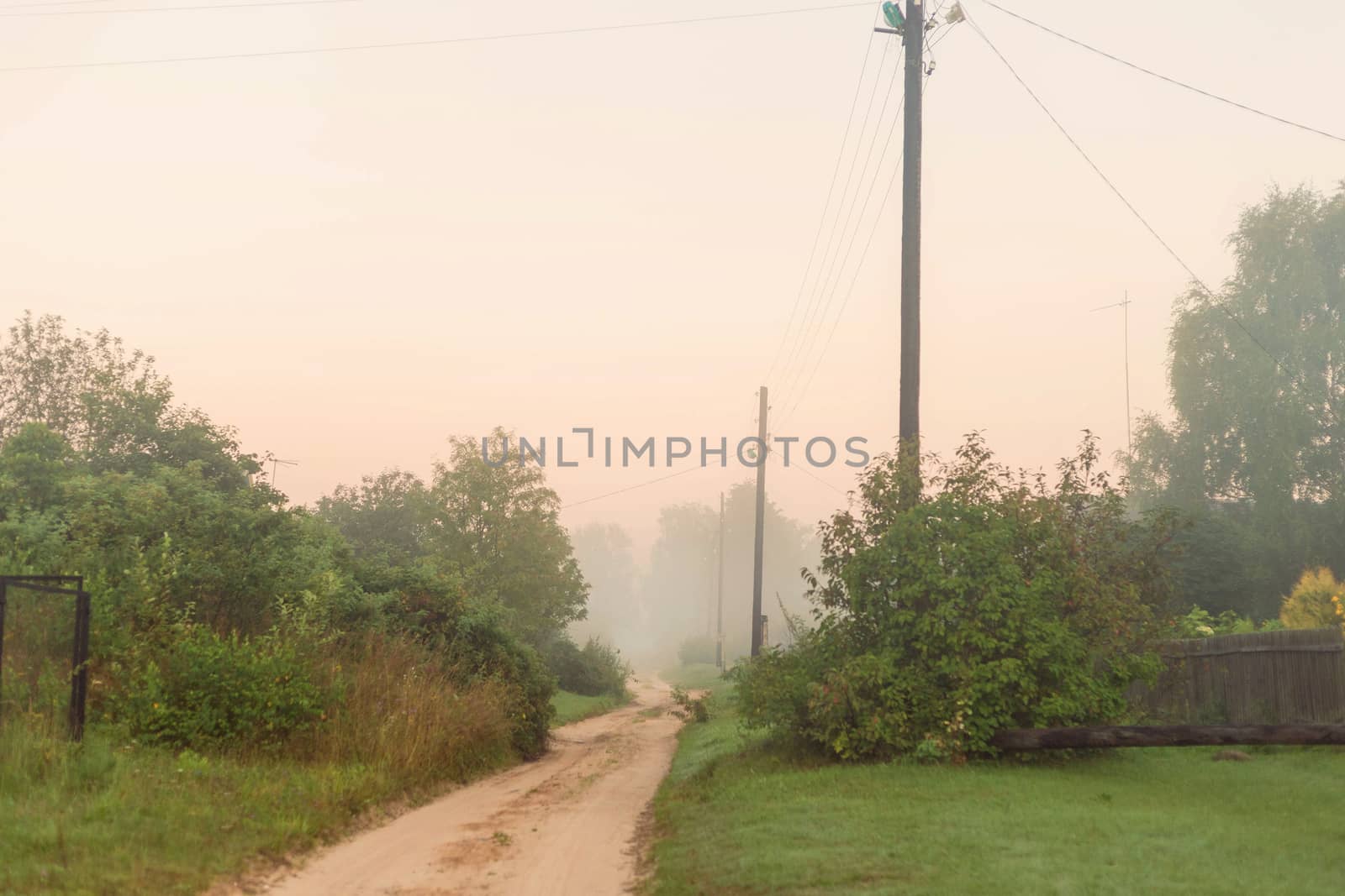 Rural landscape on a early foggy morning in the village. by galinasharapova