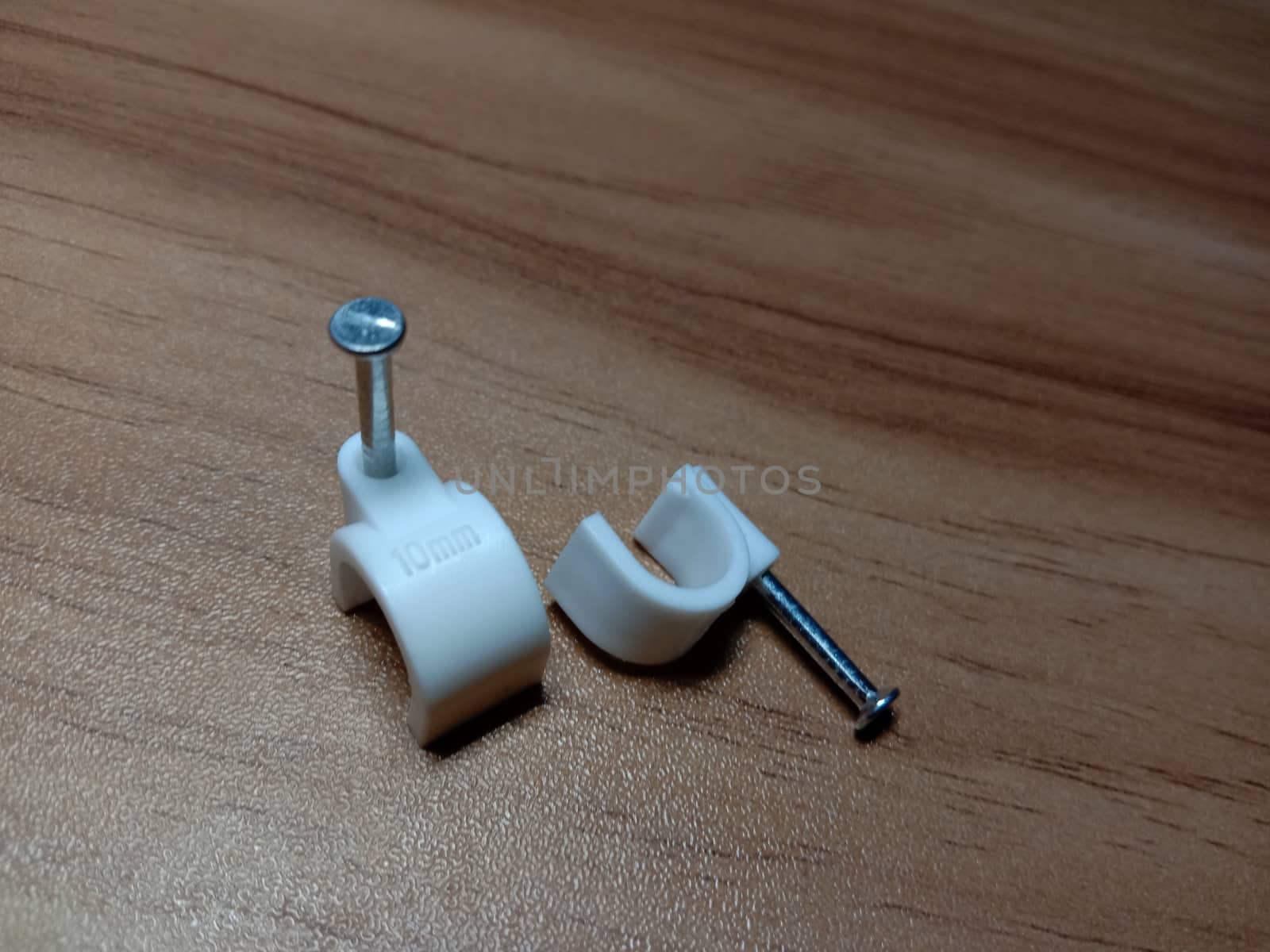 white colored wire pin on wooden table