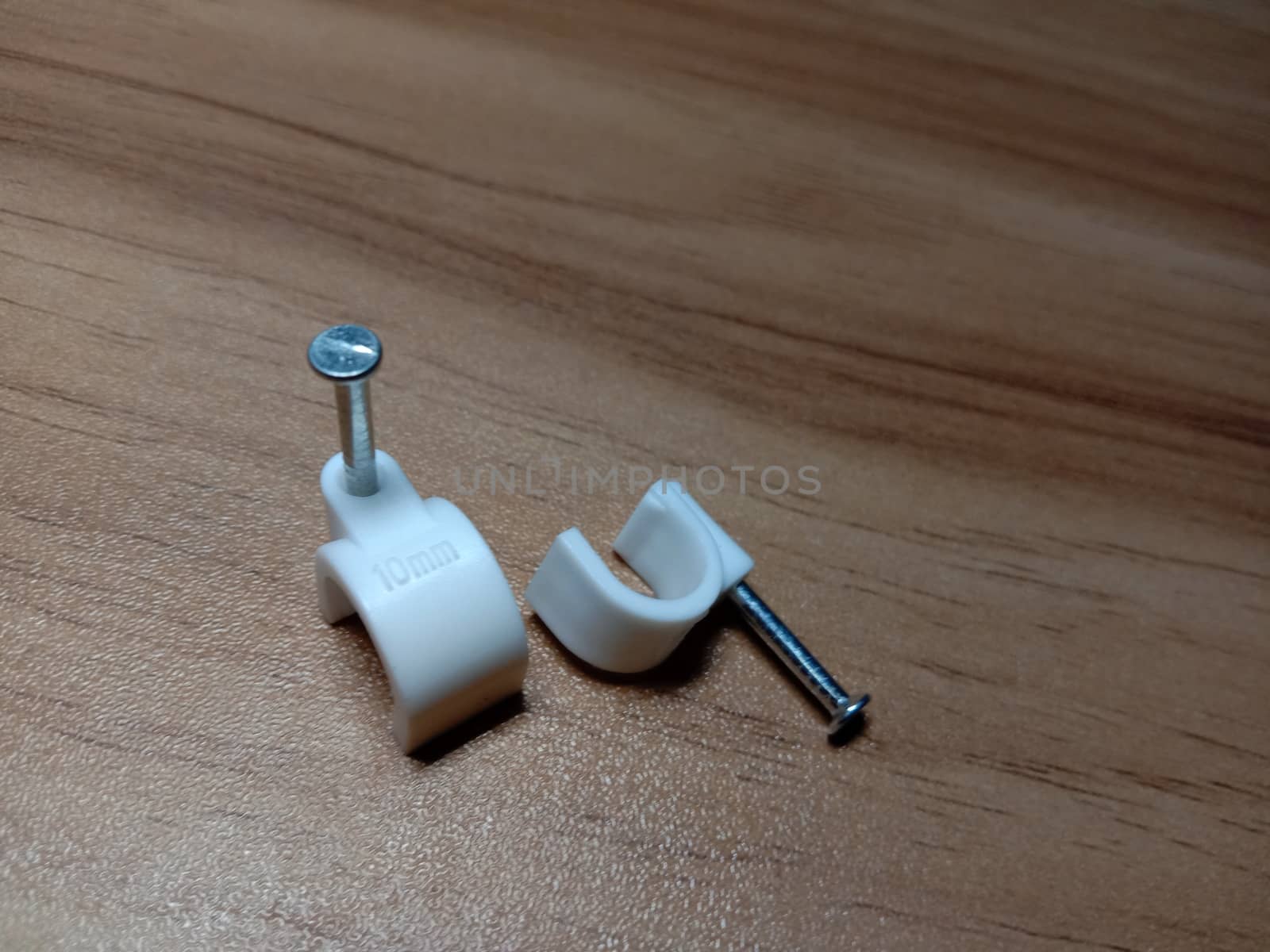 white colored wire pin on wooden table