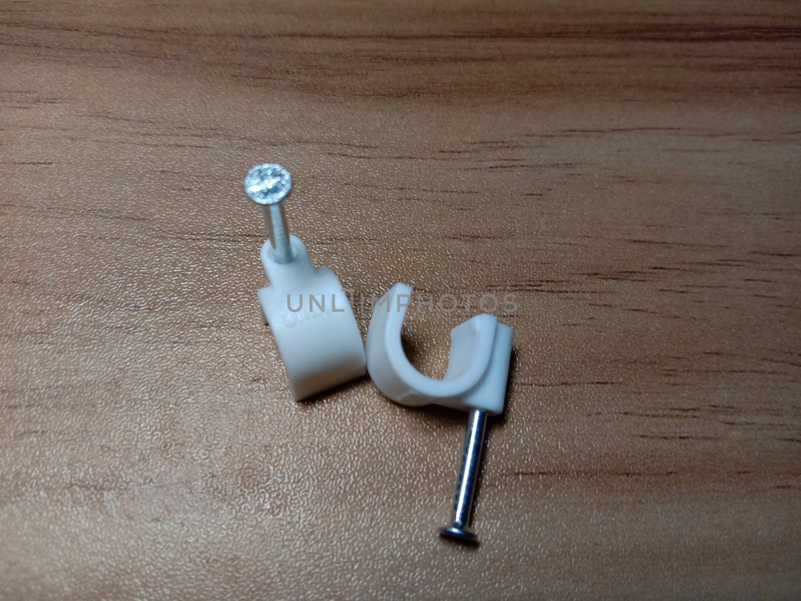 white colored wire pin on wooden table