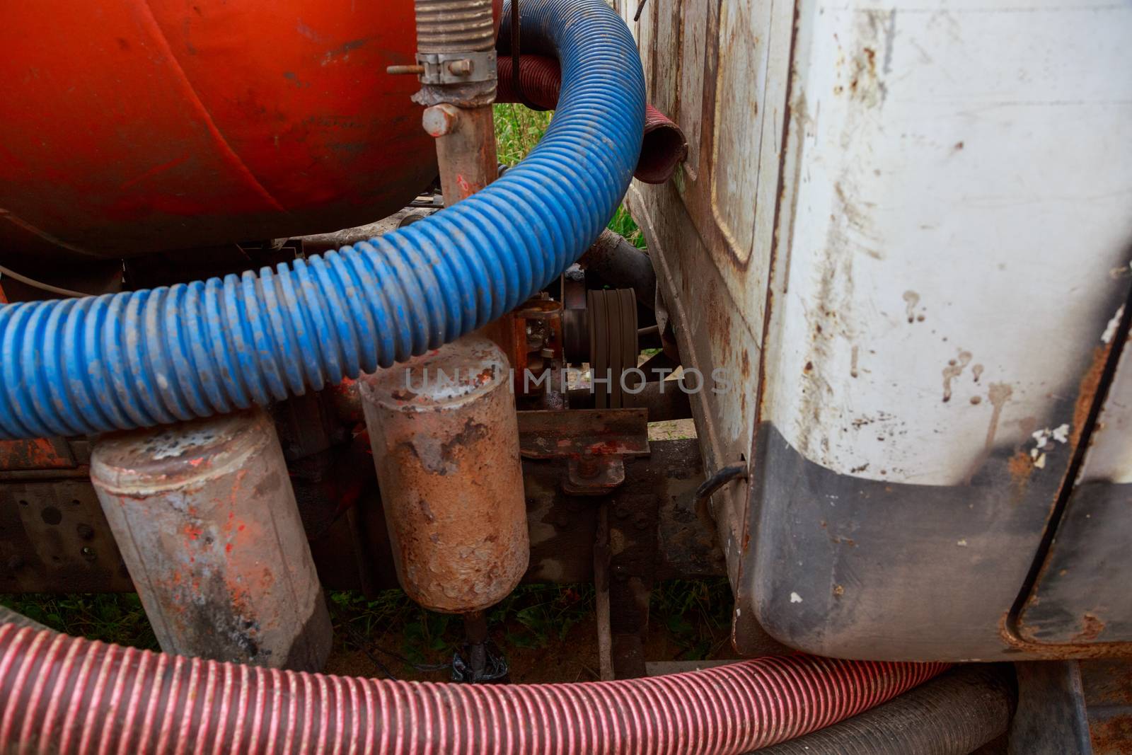 Pipe of a Sewage Pumping Machine. Providing Sewer Cleaning Service Outdoor by galinasharapova