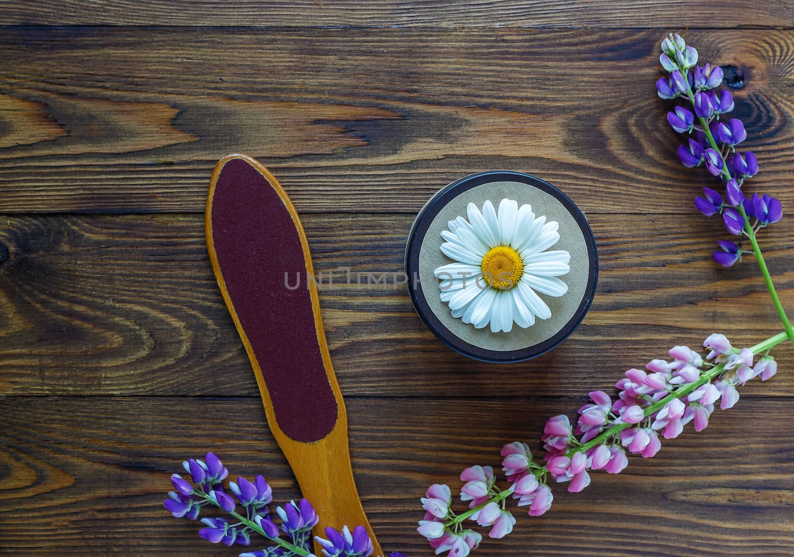 Cosmetic bottle containers with hermal camomile flowers Blank label for branding mock-up, Natural organic beauty product concept. Handmade, freshness.