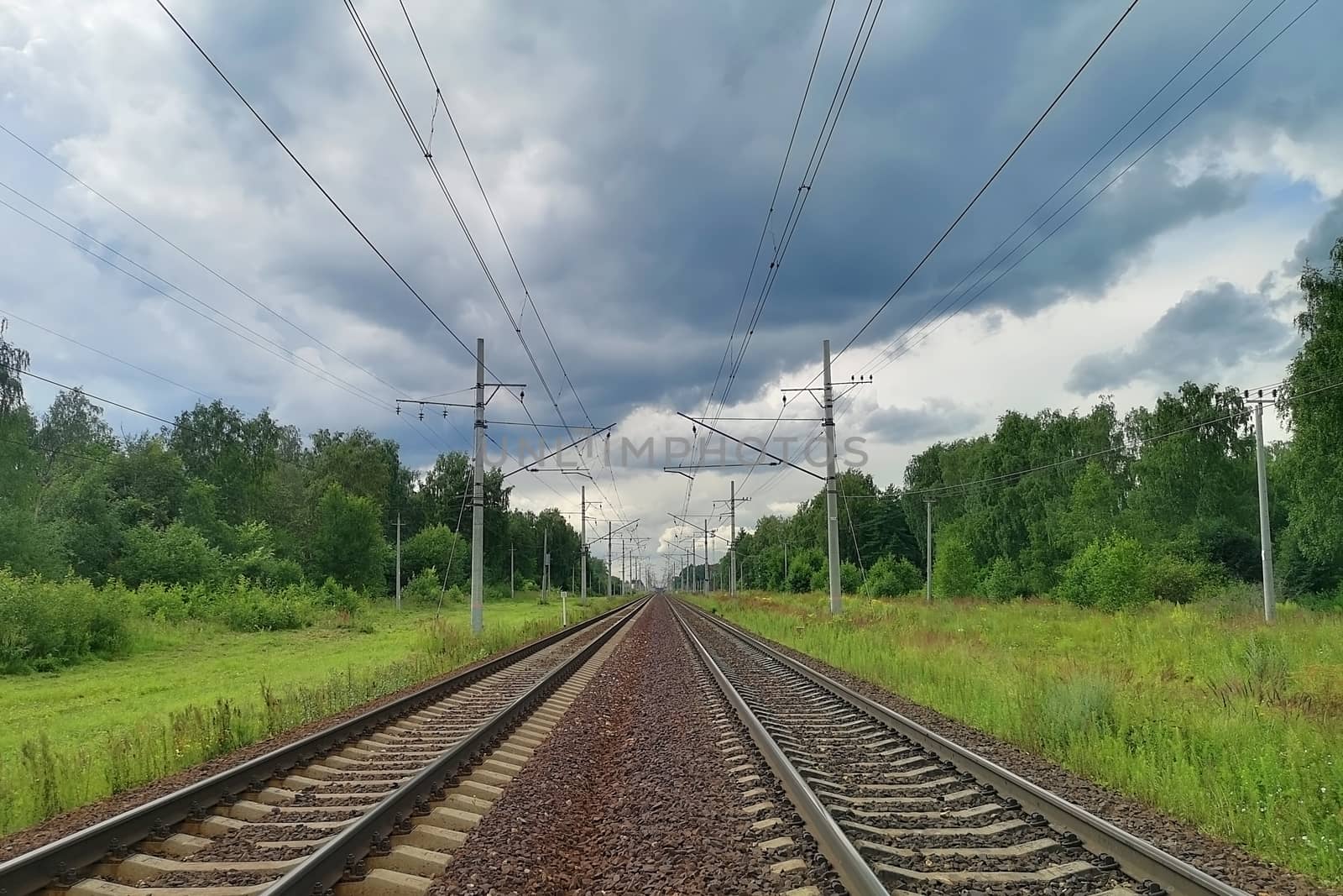 railway in a rural landscape. Evening, summer time by galinasharapova