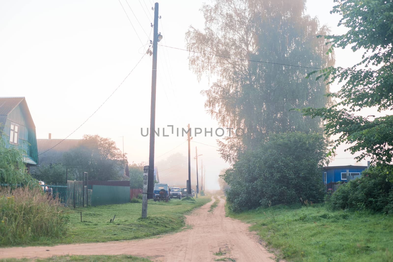 Rural landscape on a early foggy morning in the village. by galinasharapova