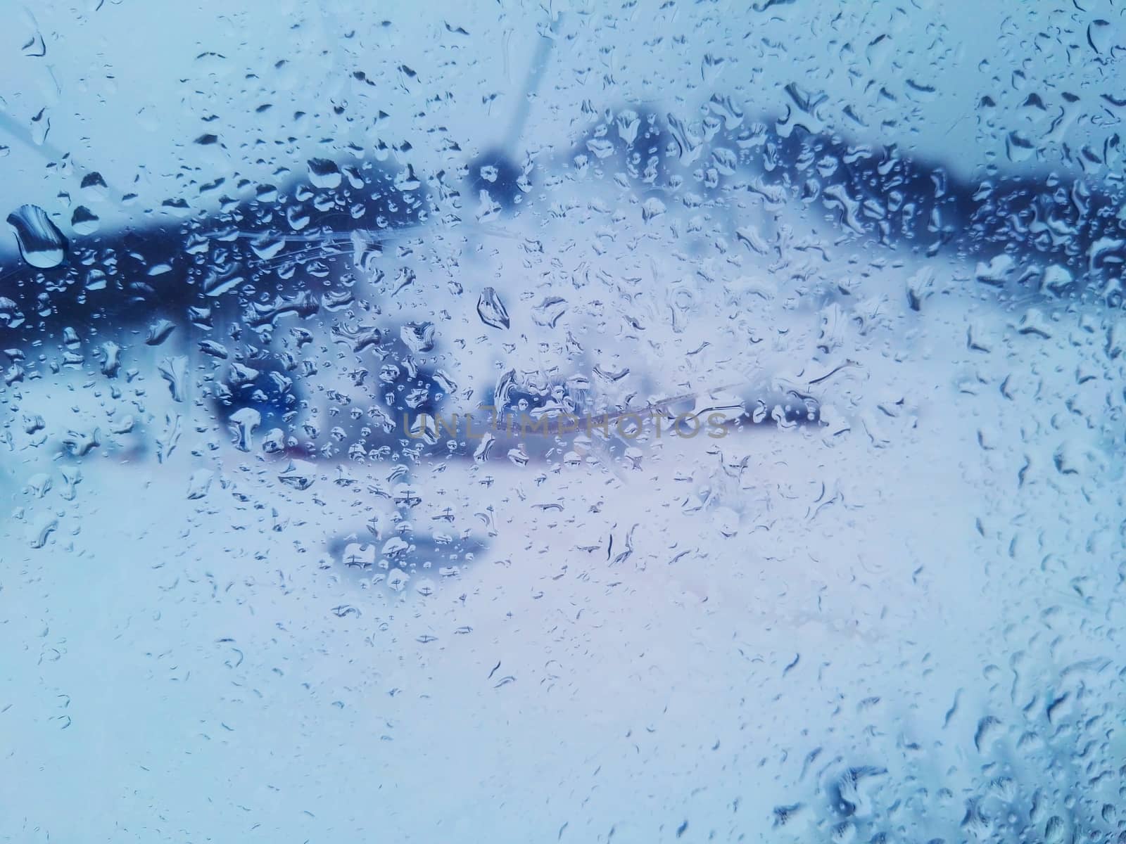 Natural water drop texture on the window glass by galinasharapova