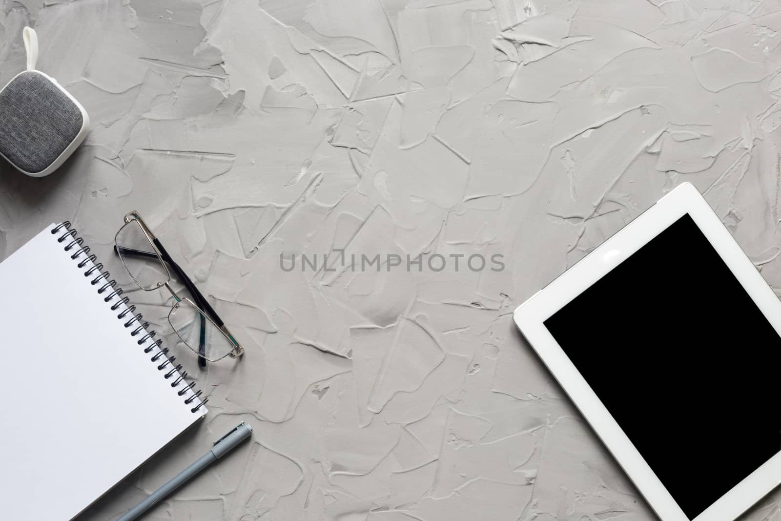 office supplies with tablet on gray color background with copy space, top view. Lunch time concept.