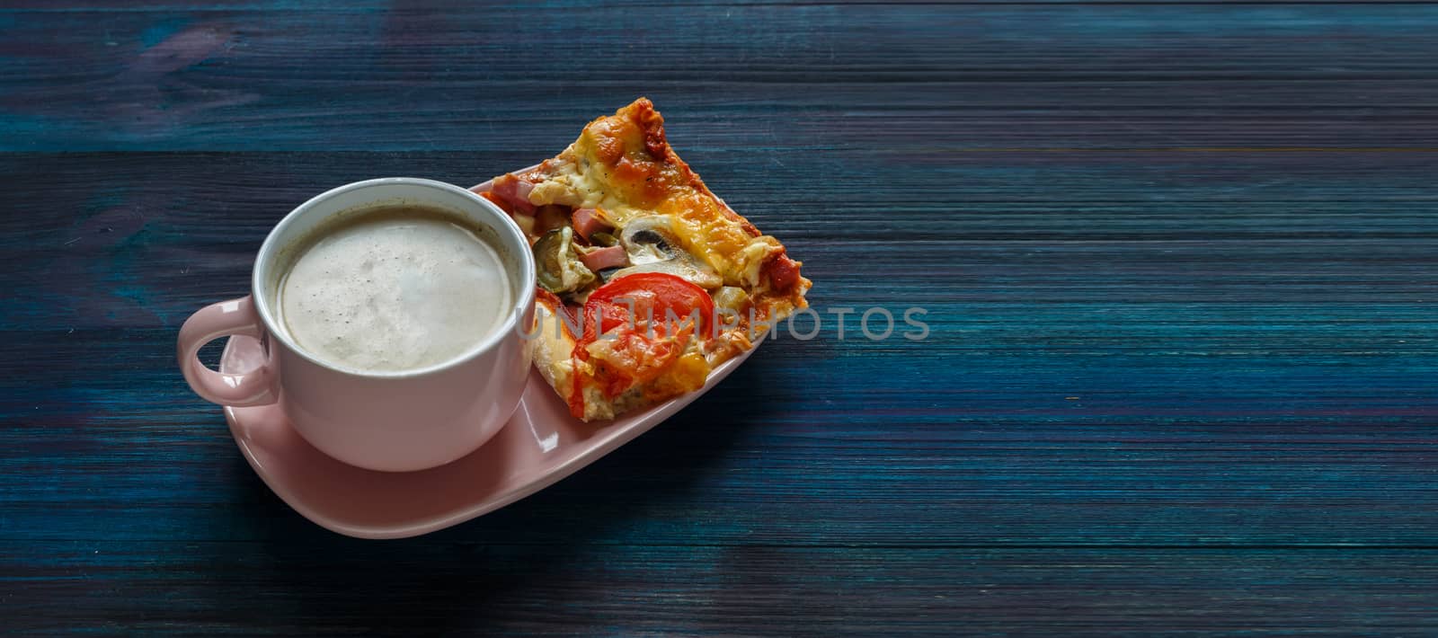 Homemade thin-crust pizza with tomatoes, mushrooms and pickled cucumbers with parmesan and cup of coffee on a dark wooden background