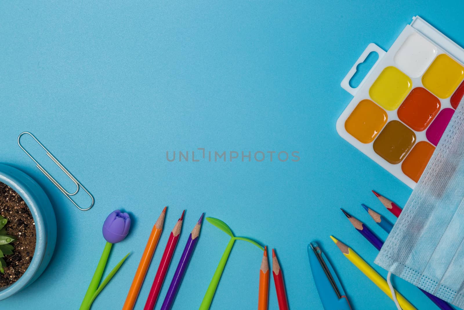 School supplies. Top view on a blue background with copy space. Back to school concept.