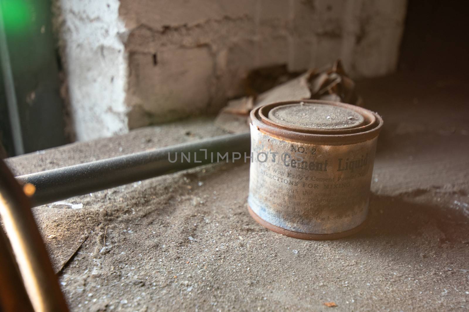 NEWARK, NEW JERSEY - JULY 17th, 2020: An Antique Can of Early's Cement Liquid Sits Forgotten in the Abandoned Proctor's Palace Theatre in Newark New Jersey.