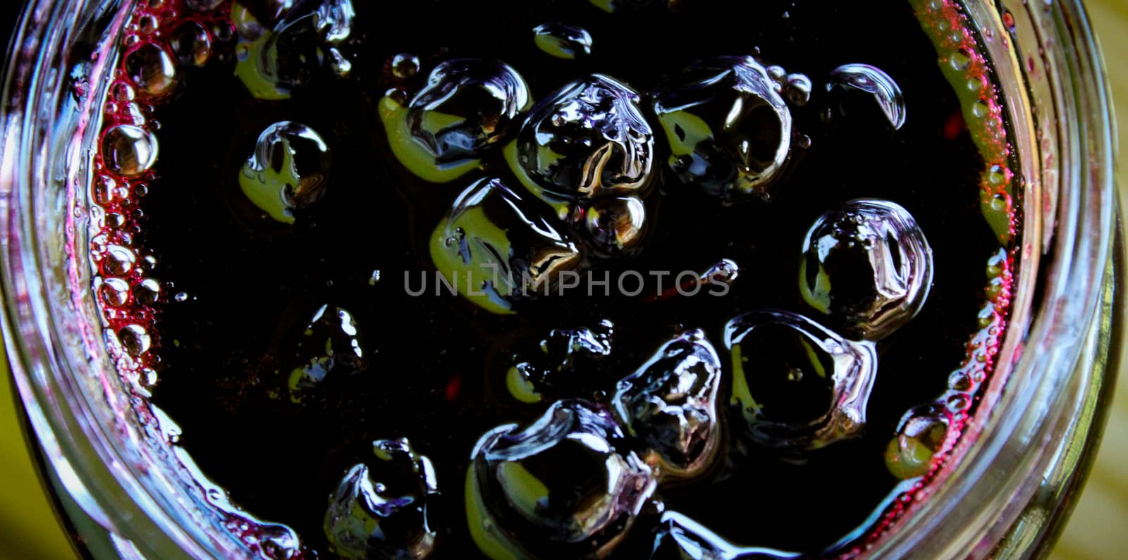 Aronia berry jam banner in a glass jar. Sweet from aronia. Zavidovici, Bosnia and Herzegovina.