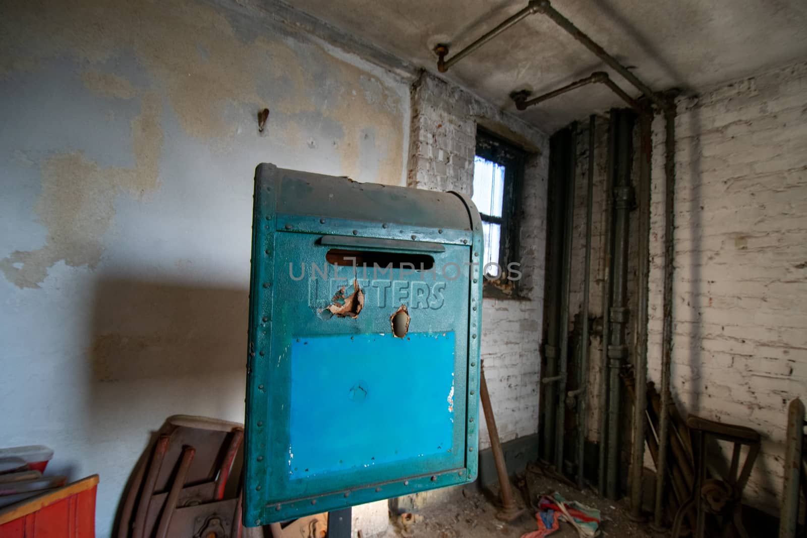 An Old Blue Mailbox Used as a Prop in a Play in an Abandoned The by bju12290