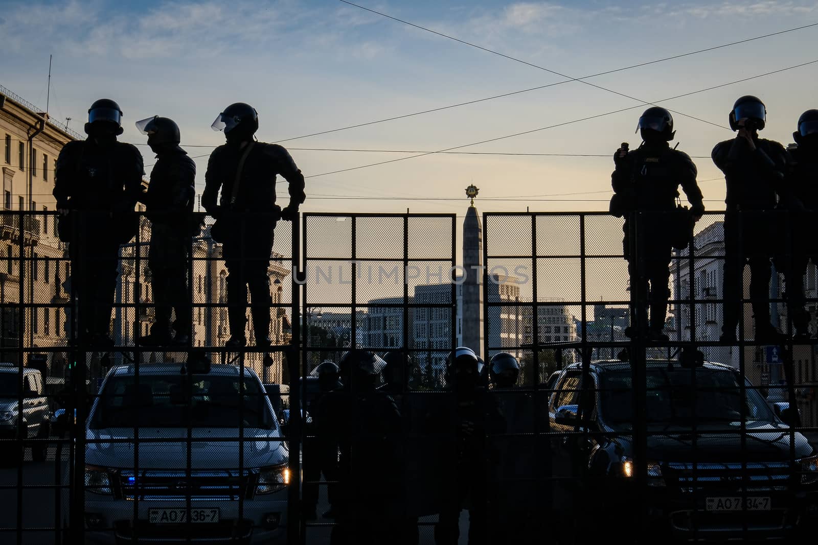 Minsk, Belarus - September 20, 2020: Riot police blocking the road for protesters with water cannons, cages and shields. by 9parusnikov