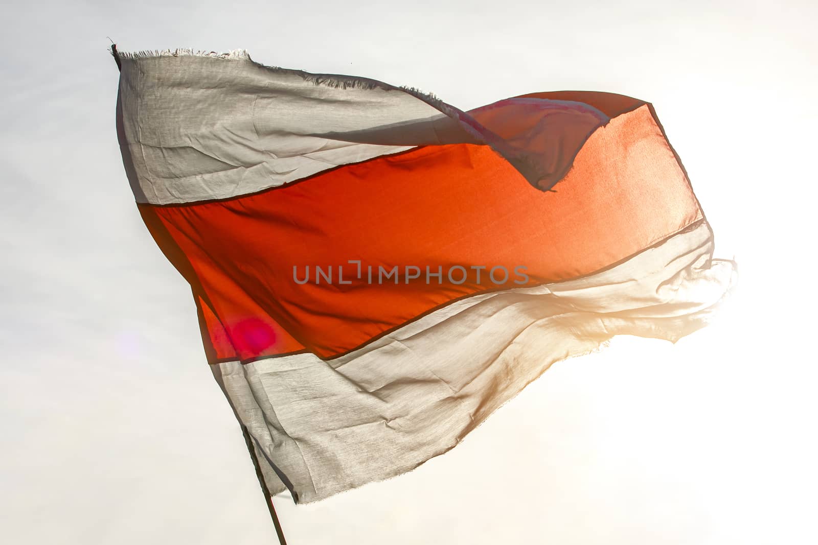 White red white flag. Historical Belarus national flag againts the sun