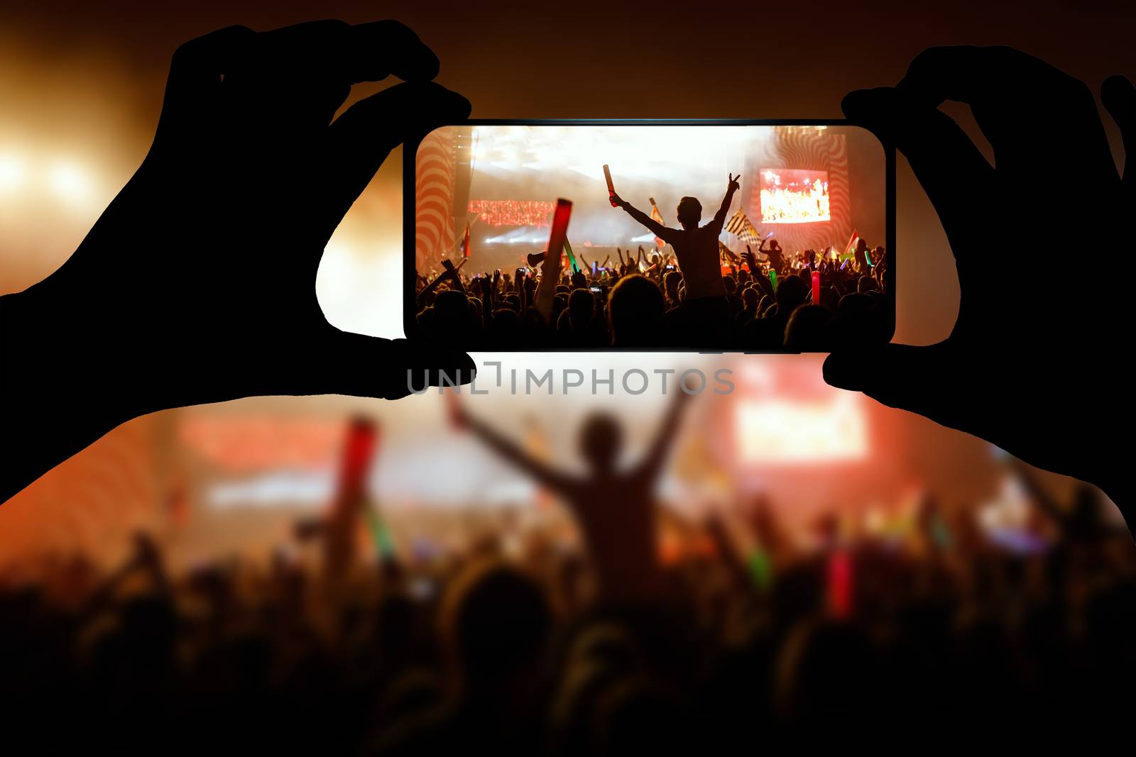 Crowds Enjoying Themselves At Outdoor Music Festival, Night time