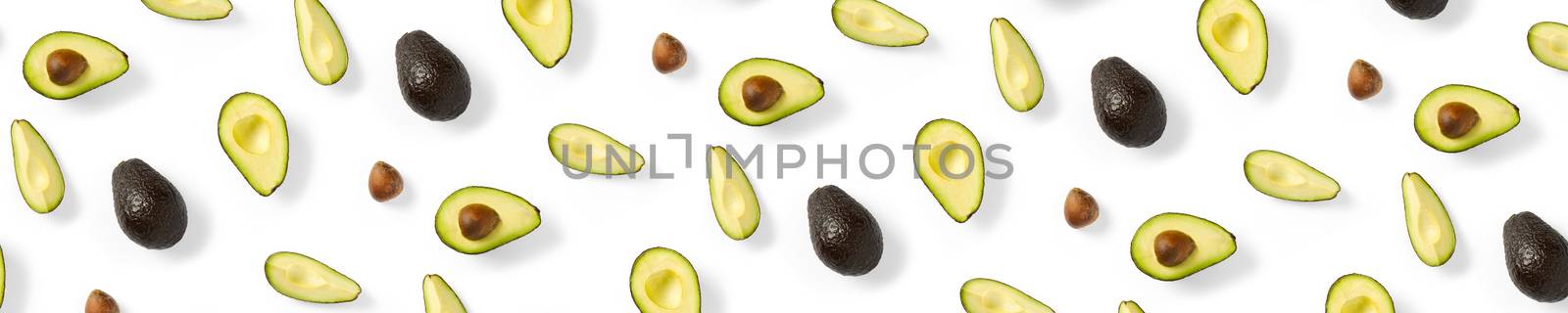 Avocado banner. Background made from isolated Avocado pieces on white background. Flat lay of fresh ripe avocados and avacado pieces. by PhotoTime