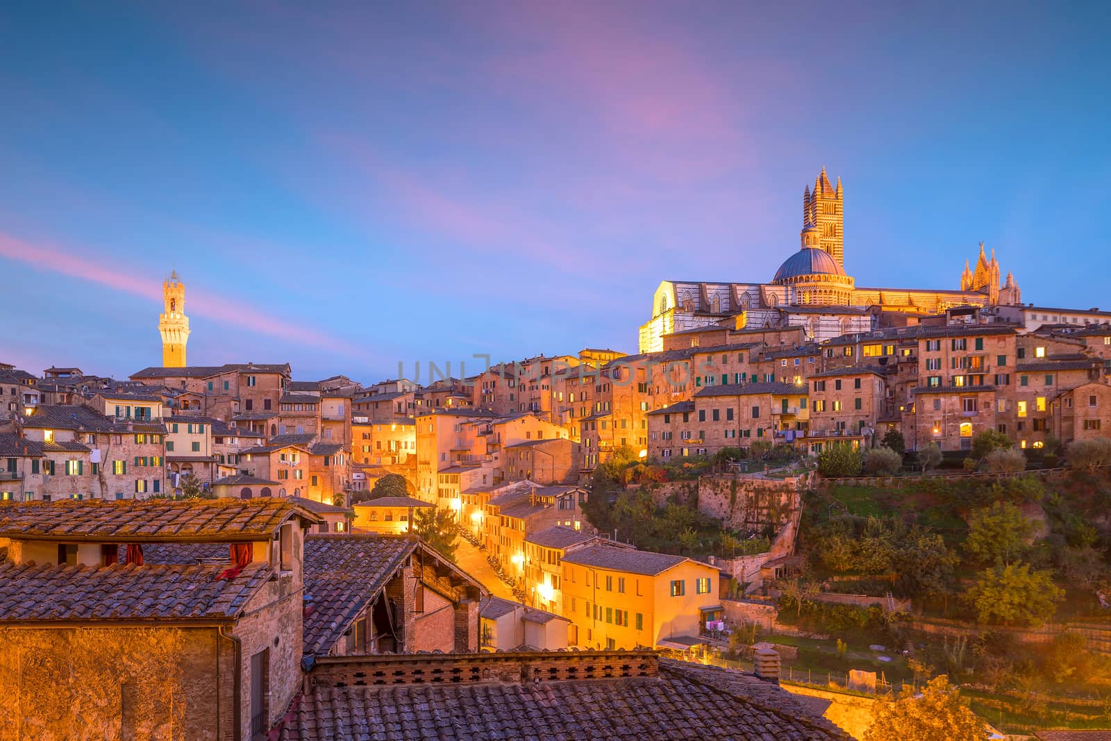 Downtown Siena skyline in Italy with beautiful sunset
