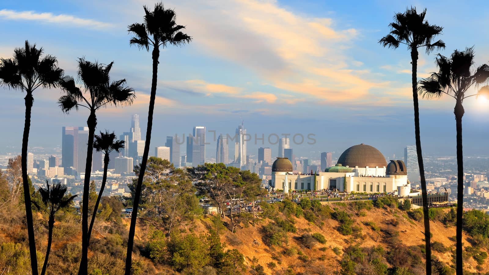 The Griffith Observatory and Los Angeles city skyline at sunset CA