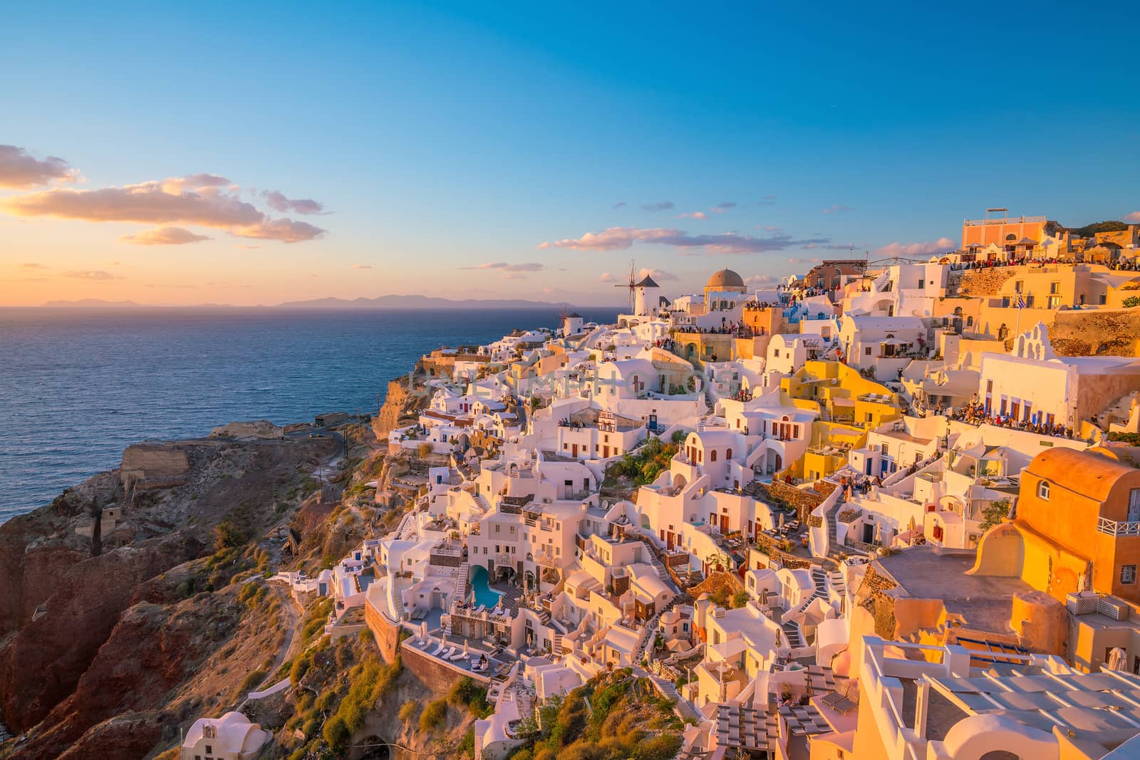 Oia town cityscape at Santorini island in Greece at sunset. Aegean sea