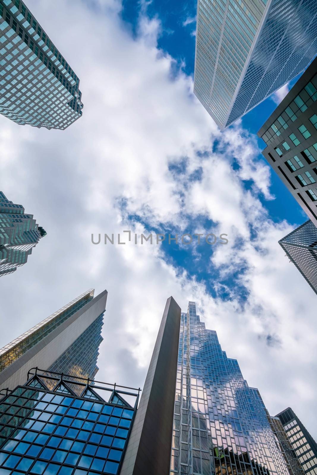 Looking up shot of downtown financial district with skyscrapers  by f11photo