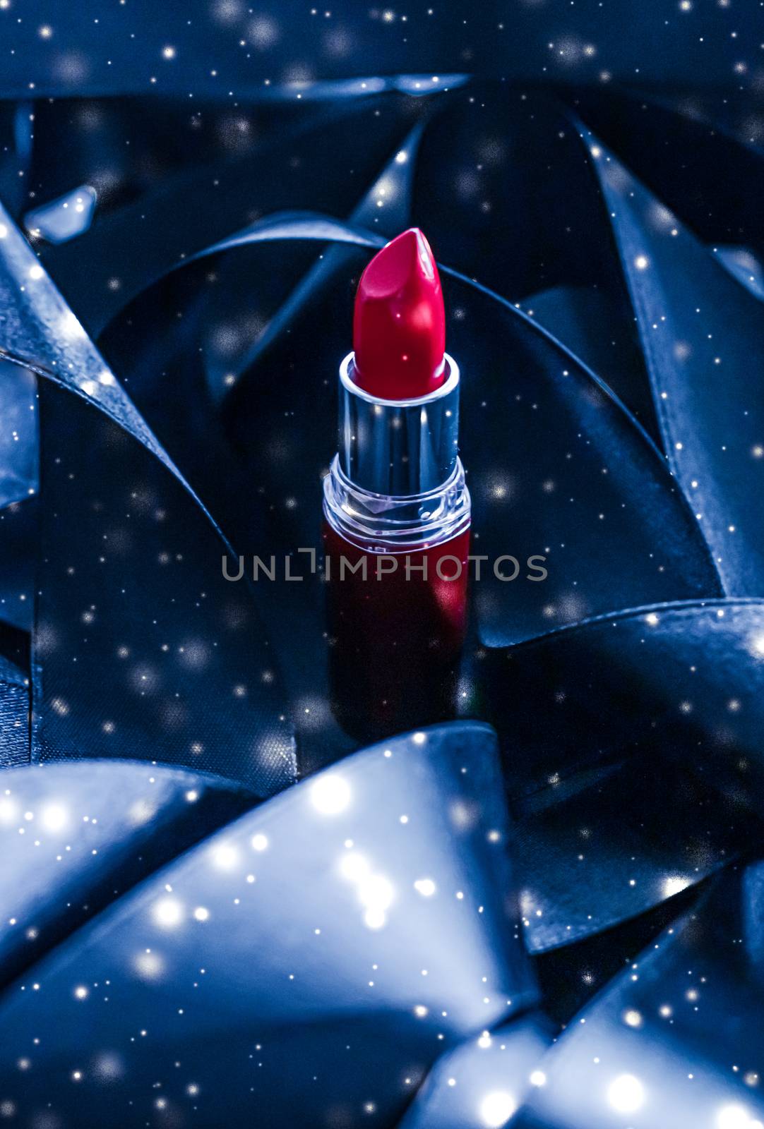 Red lipstick on blue silk and shiny glitter background, luxury make-up and beauty cosmetic by Anneleven