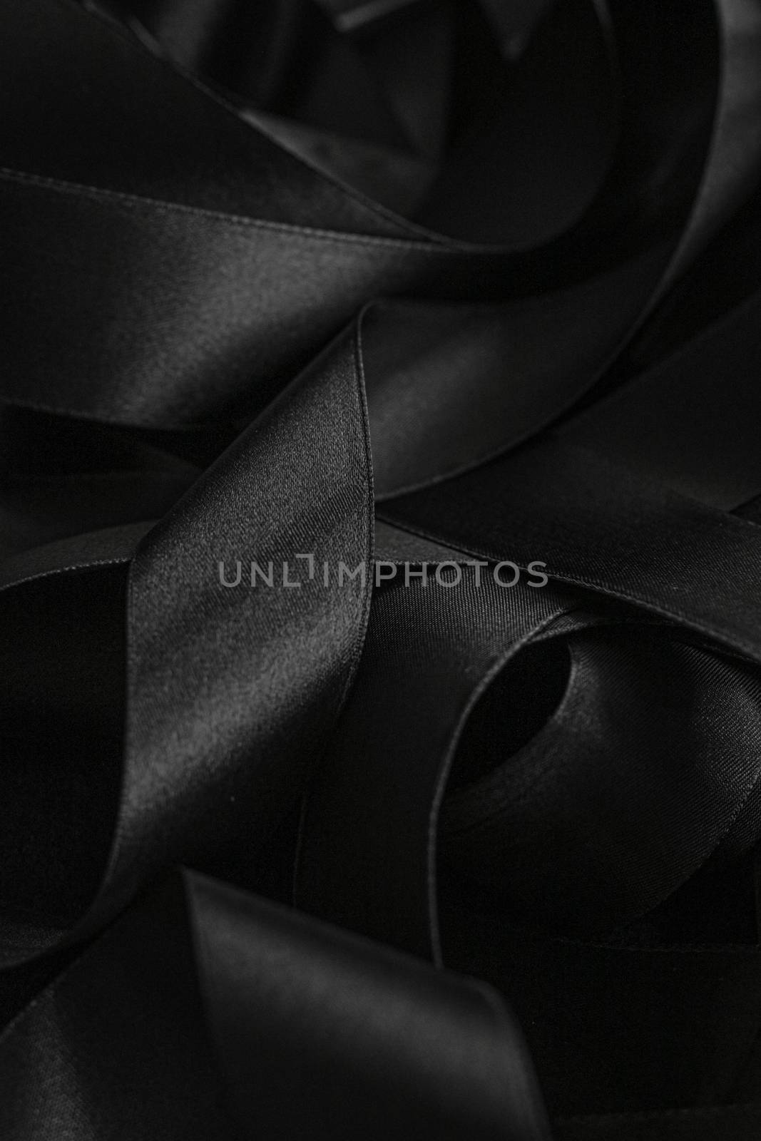 Black silk ribbon as background, abstract and luxury brand designs