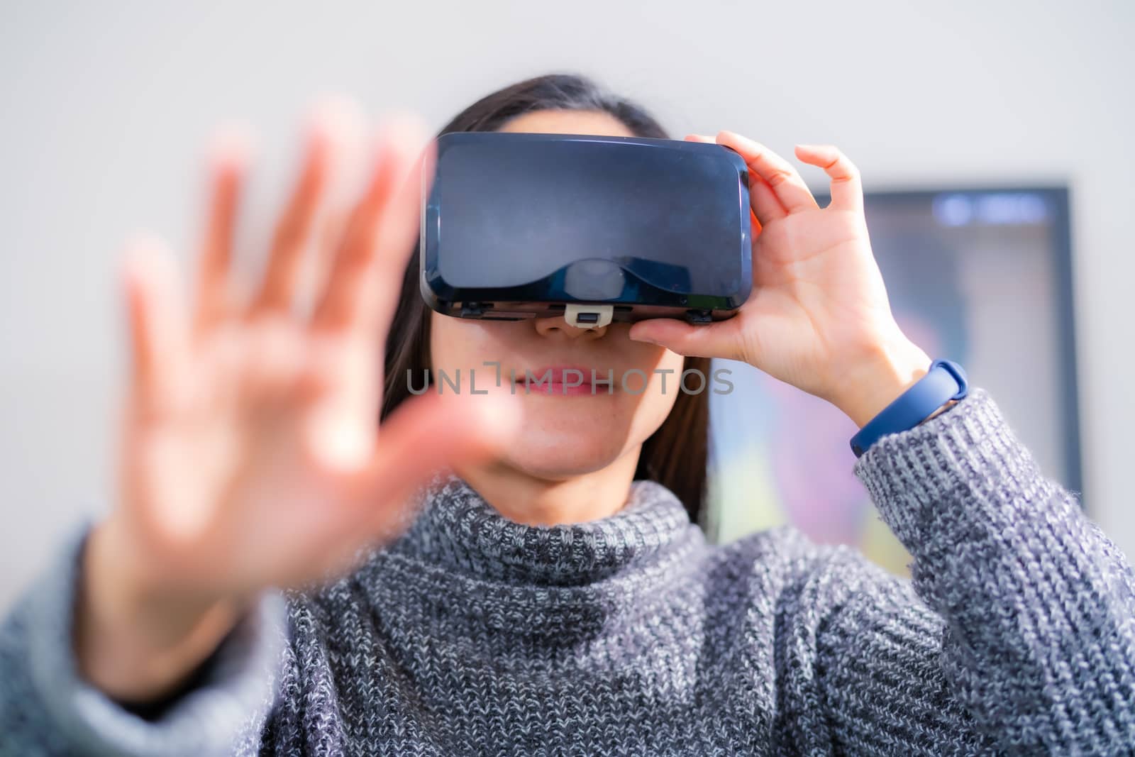 woman wearing virtual reality glasses. Smartphone using with VR headset