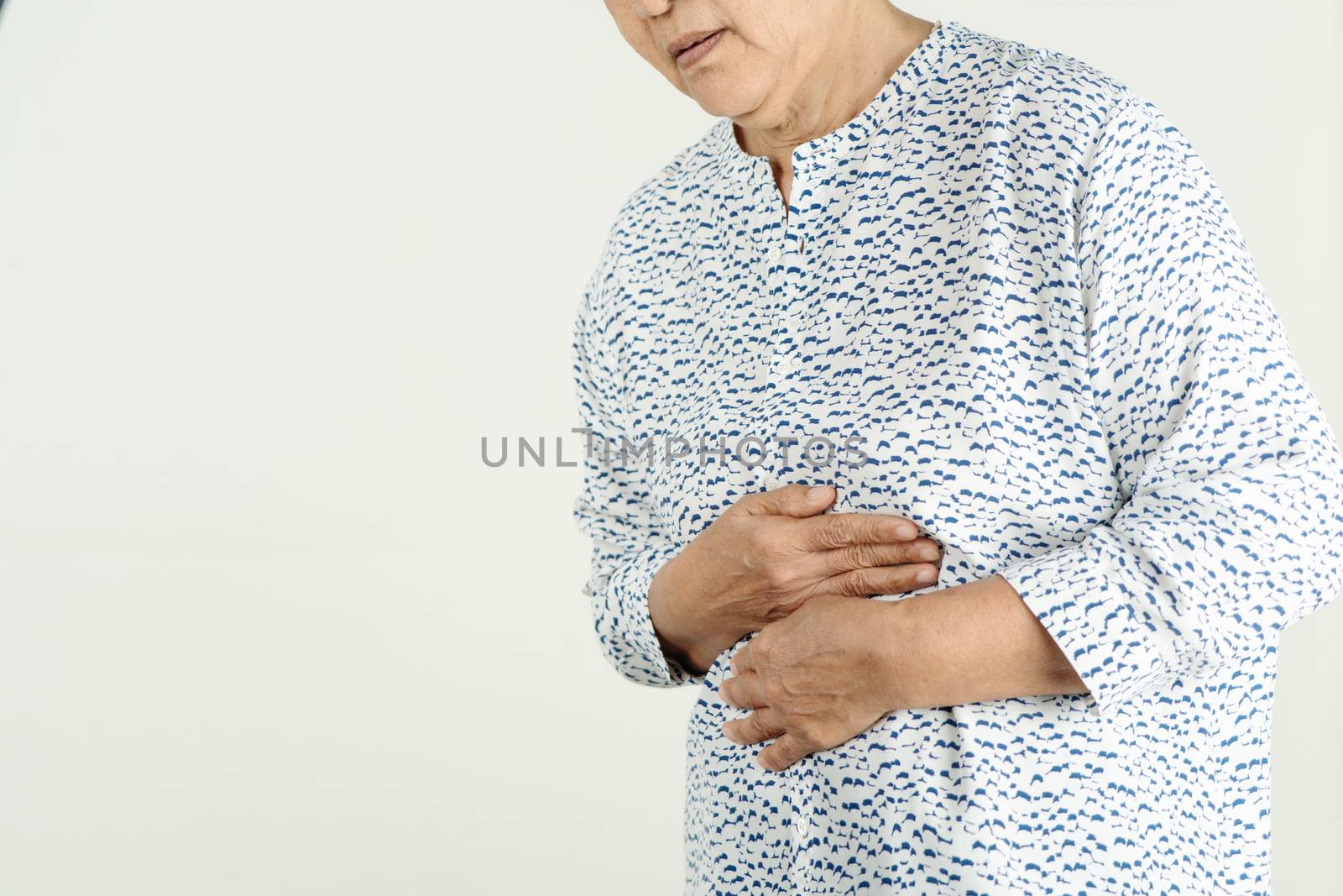 Senior woman Suffering From Acid Reflux Or Heartburn-Isolated On White Background