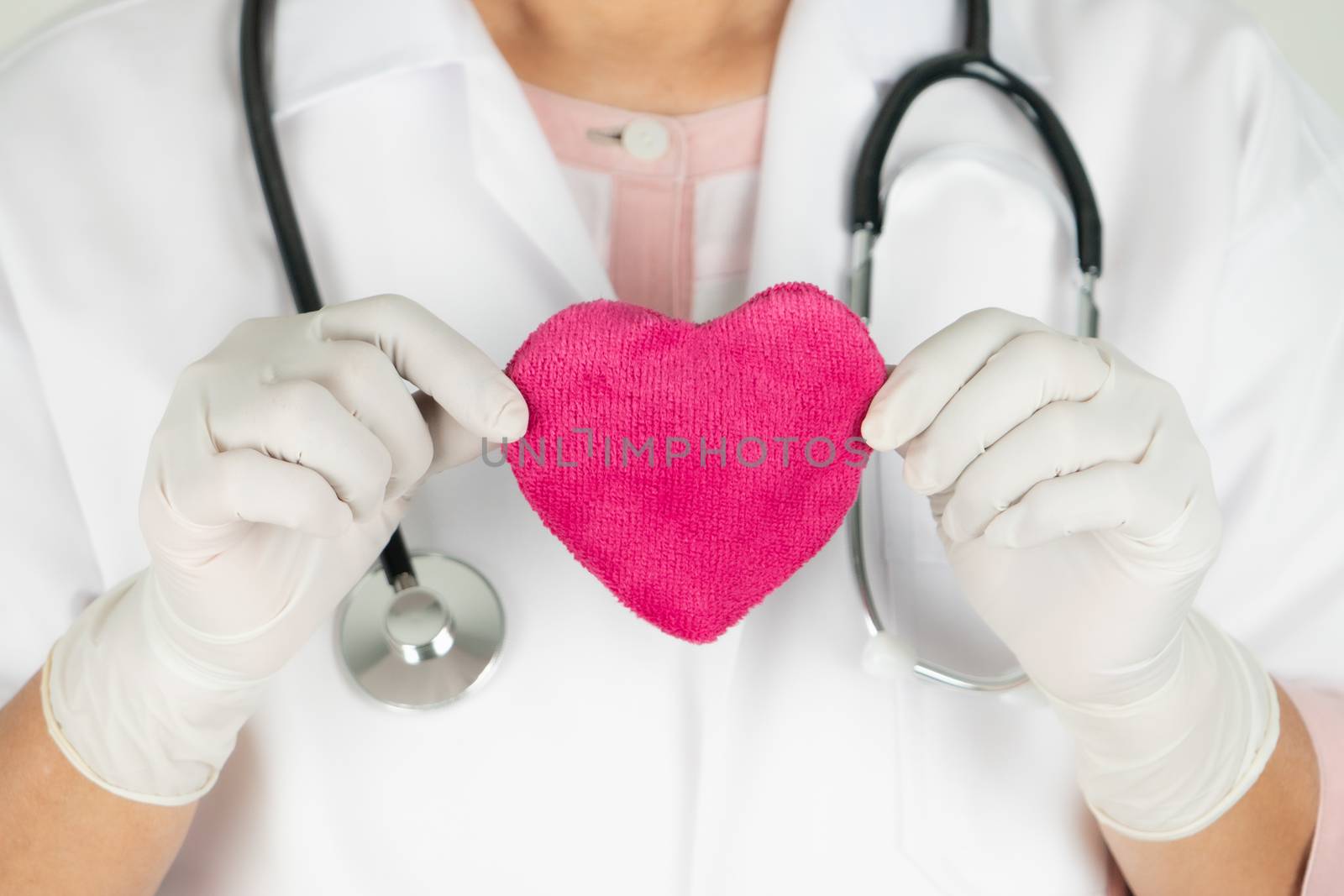 World heart health day concept and Healthcare medical insurance with doctor with stethoscope holding red heart