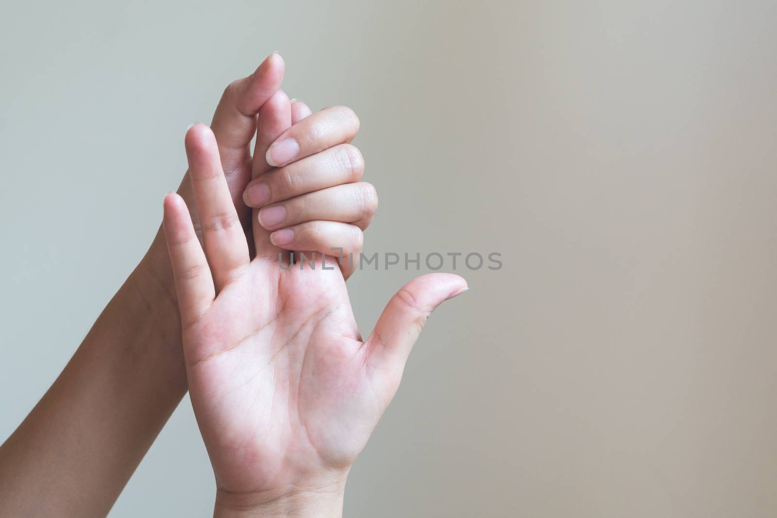 Woman massaging her painful hand. Healthcare and medical concept by psodaz