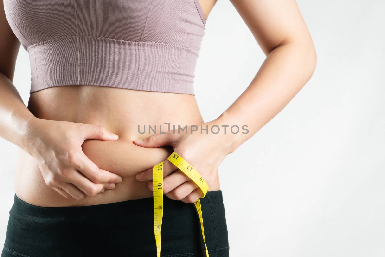 fat woman, fat belly, chubby, obese woman hand holding excessive belly fat with measure tape, woman diet lifestyle concept