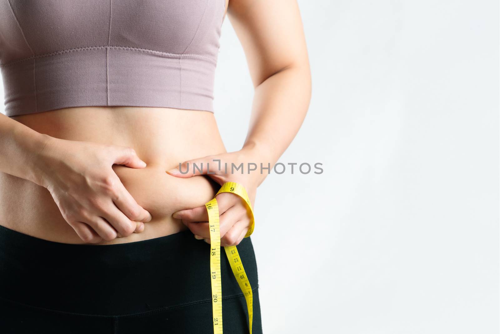 fat woman, fat belly, chubby, obese woman hand holding excessive belly fat with measure tape, woman diet lifestyle concept