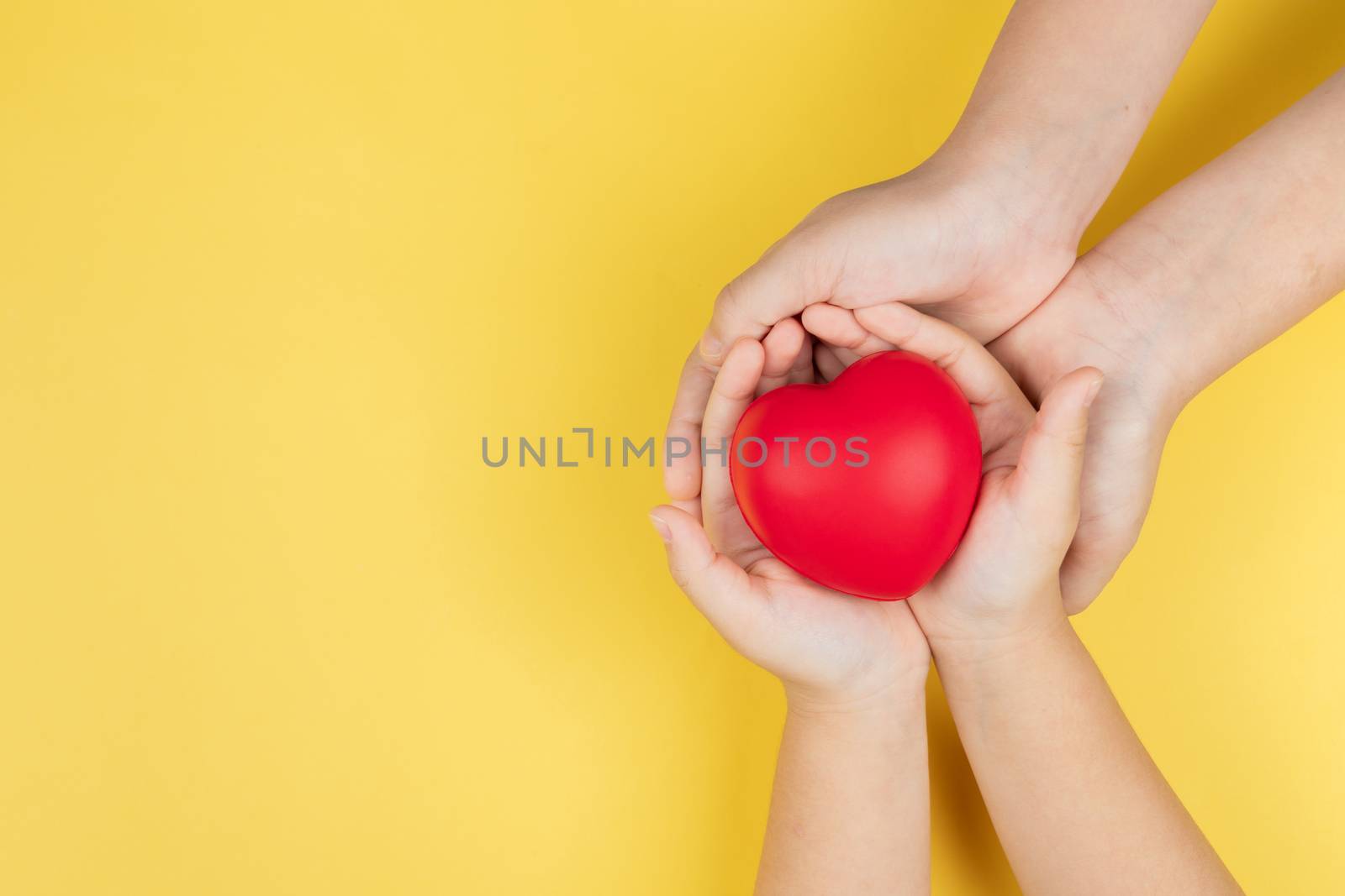 world health day, adult and child hands holding red heart, healthcare, love and family insurance concept