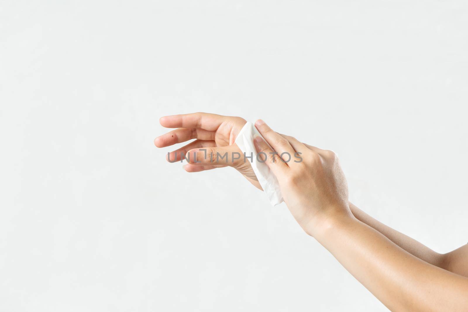 Woman cleaning her hands with white soft tissue paper. isolated on a white backgrounds