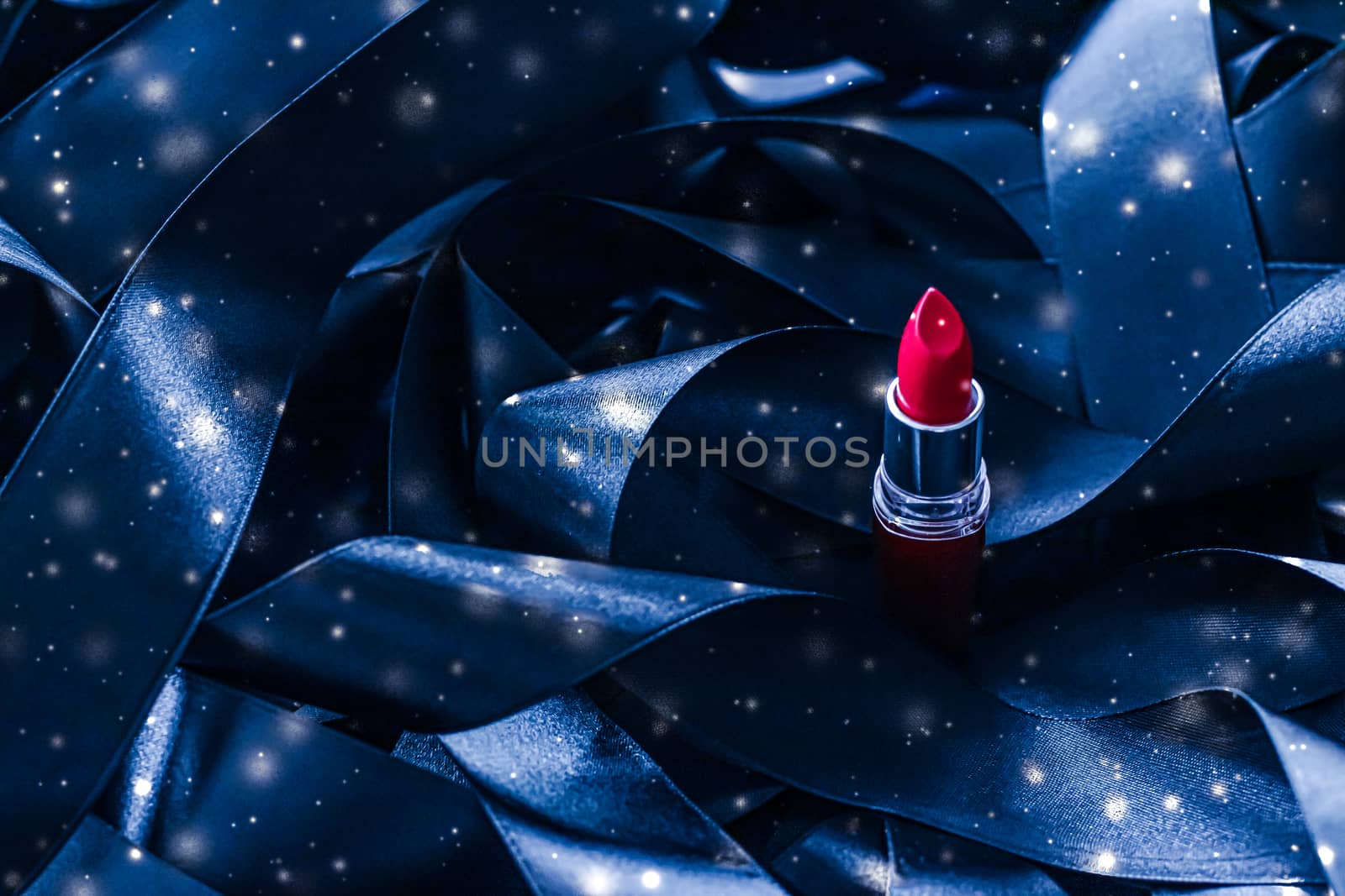 Red lipstick on blue silk and shiny glitter background, luxury make-up and beauty cosmetic by Anneleven