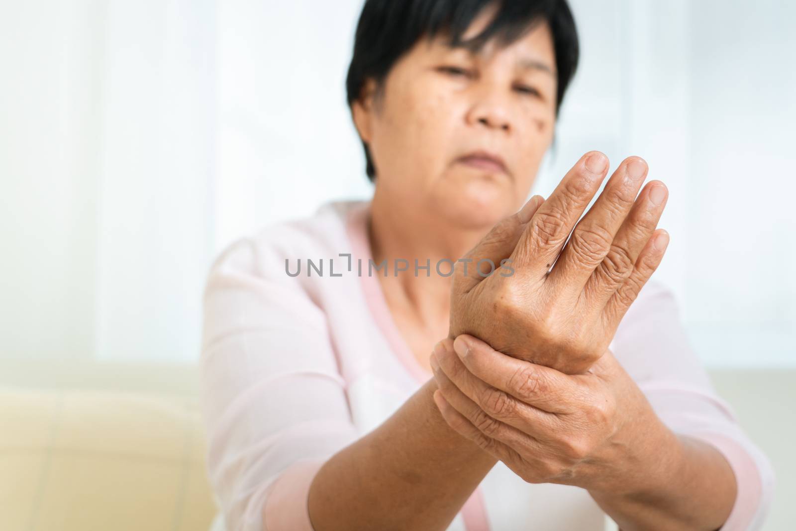 wrist hand pain of old woman, healthcare problem of senior conce by psodaz