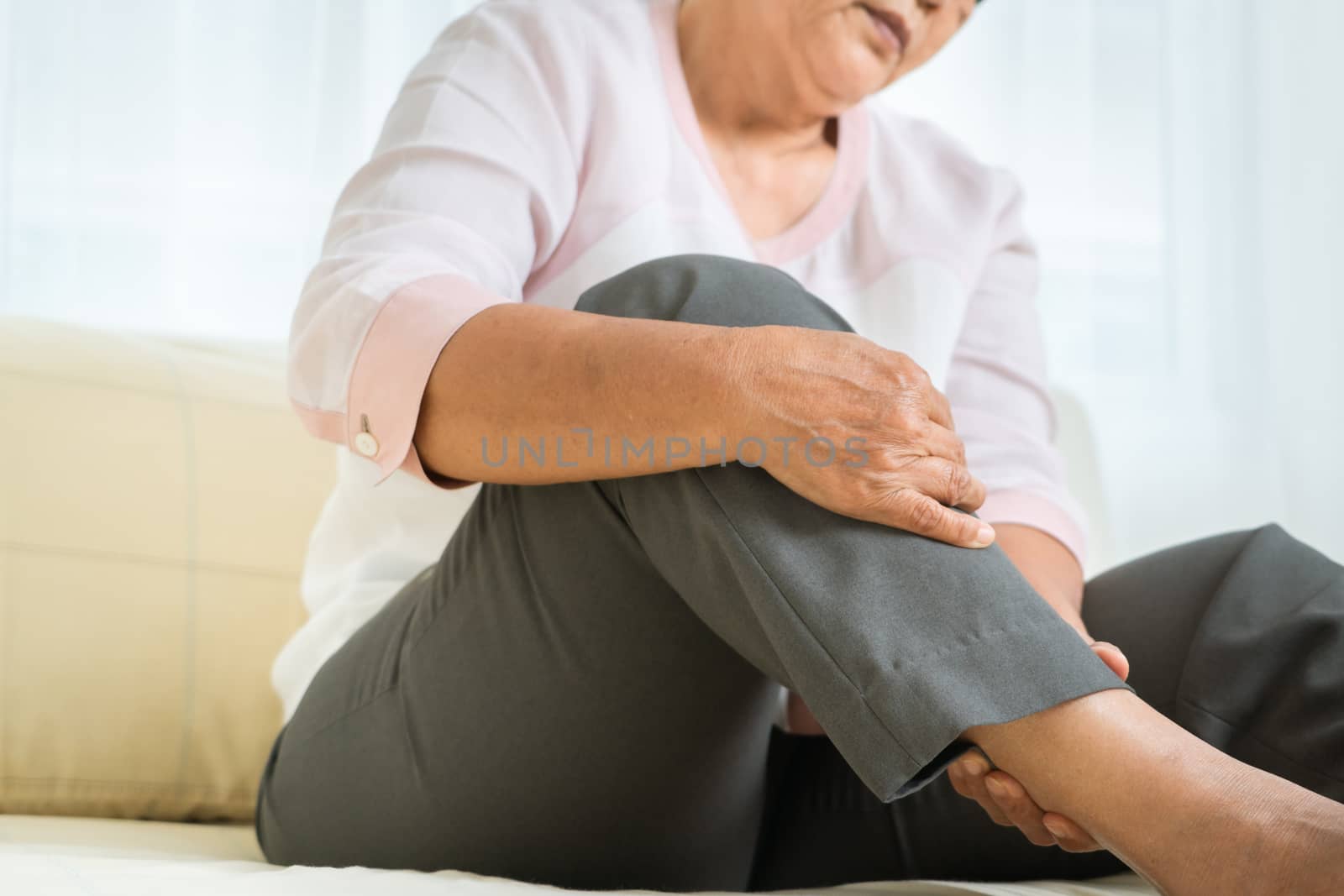 leg pain of senior woman at home, healthcare problem of senior c by psodaz