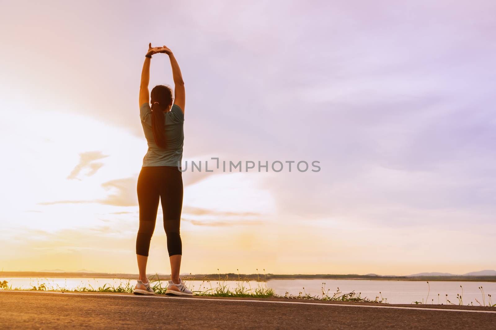 sport woman is stretching muscle before workout