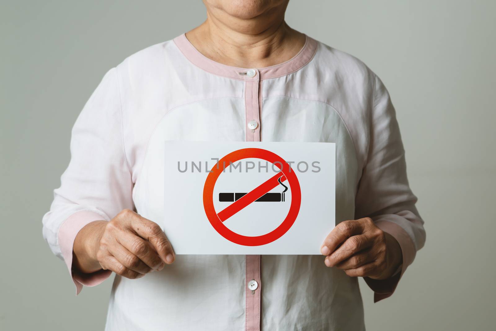 Quit smoking, no tobacco day, mother holding no smoking sign